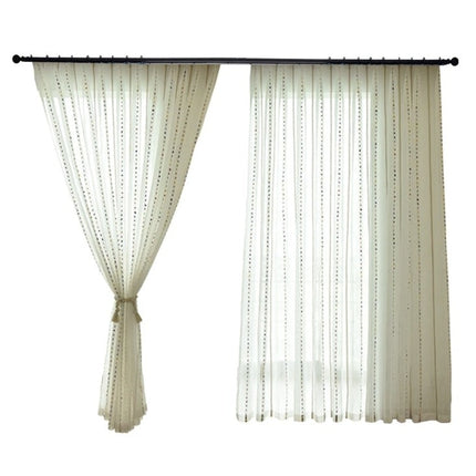 Visillo de lino con pompones